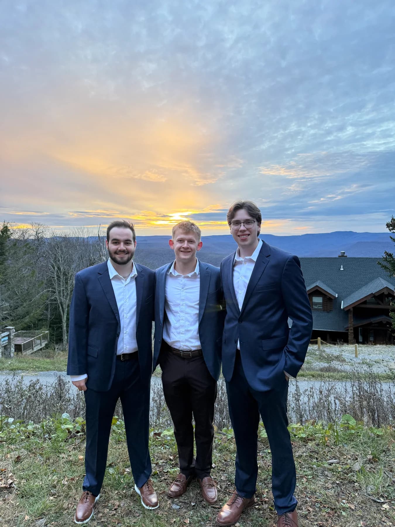Three friends outdoors at sunset
